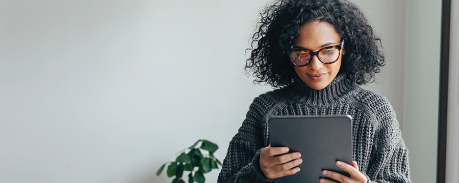 Woman reviewing her taxes on her tablet.