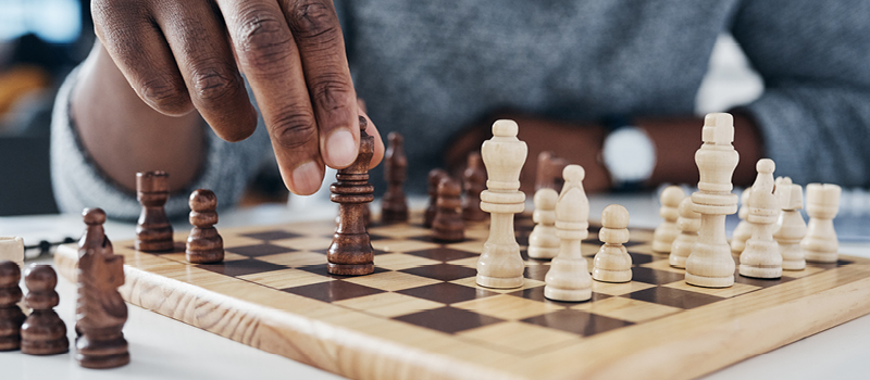 Chess game in progress at a low angle