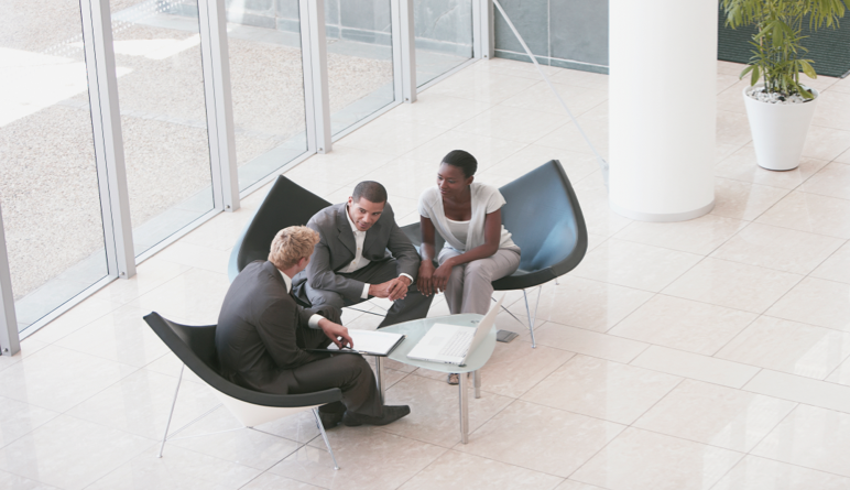 An Ameriprise advisor meets with two clients